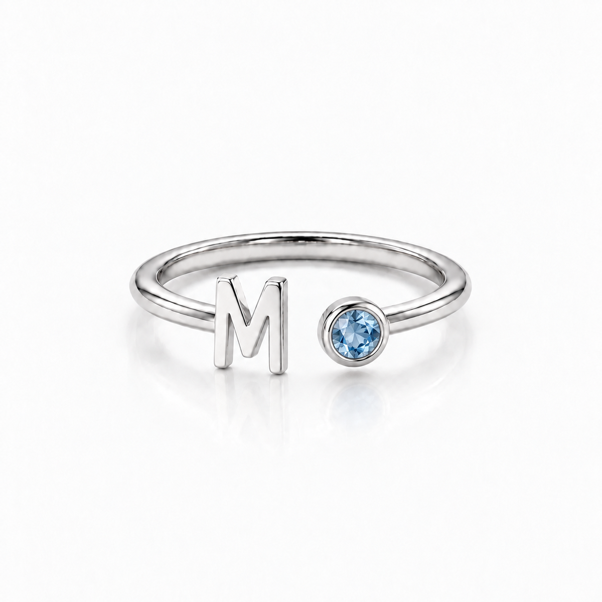 Silver Monty initial birthstone ring with letter M and blue birthstone